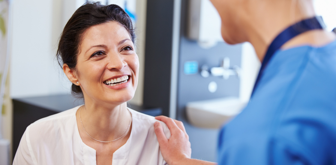 Female Patient Being Reassured By Doctor In Hospital Room at the Lotus Endometriosis Institute