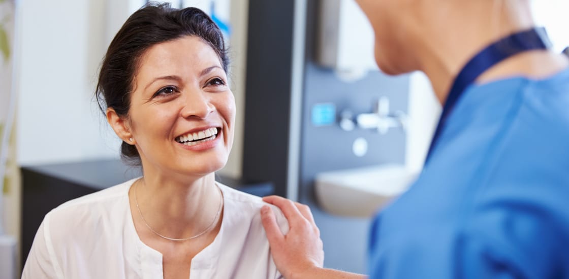 Female Patient Being Reassured By Doctor In Hospital Room at the Lotus Endometriosis Institute