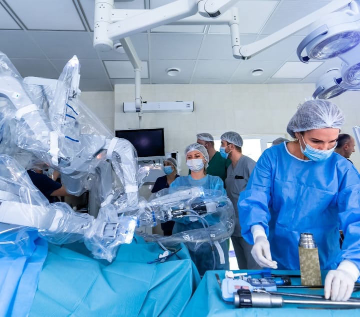 A team of surgeons performing robotic surgery.